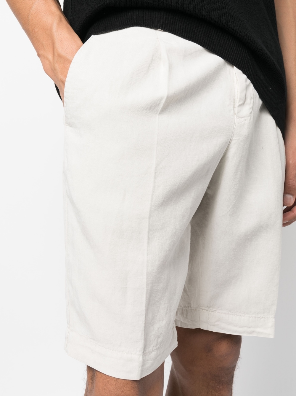 Bermuda shorts off-centre buttons