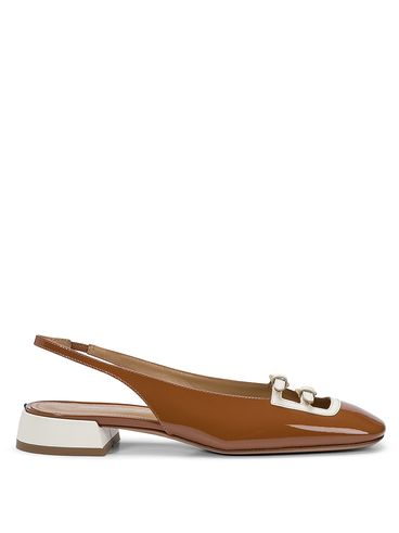 Patent leather slingback with heart buckles