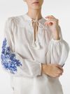 Linen blouse with contrast embroidery