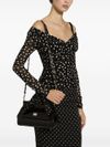 Stretch tulle top with crossover neckline and polka dot print