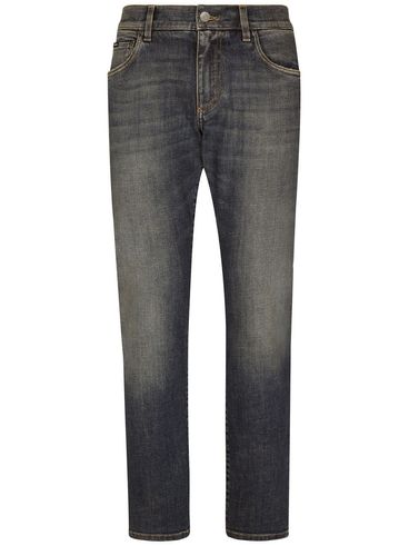 Straight cut stretch cotton jeans with distressed effect