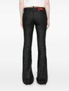 Flared stretch cotton jeans with mid-rise and distressed effect