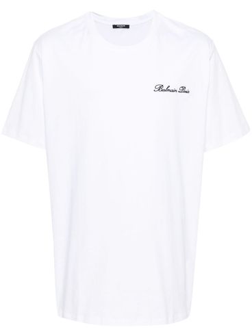 T-shirt in cotone con logo ricamato frontale in corsivo