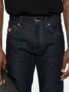 Jeans slim in cotone a vita media