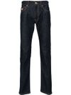 Jeans slim in cotone a vita media