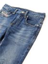 Jeans slim in cotone stretch a vita media con strappi