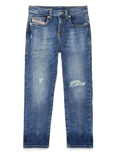Slim-fit stretch cotton jeans with mid-rise and distressed detailing