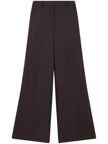 Wool trousers with mid-rise waist and flared hem
