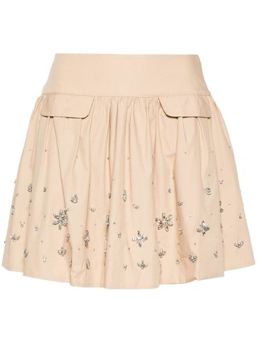 Mini skirt in viscose and linen with crystal appliqués