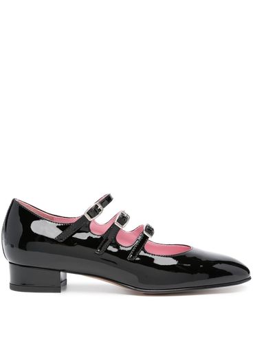 Ariana ballet flats in patent calf leather with straps.