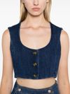 Top crop in denim con scollo ampio