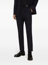 Tailored wool trousers with pressed crease