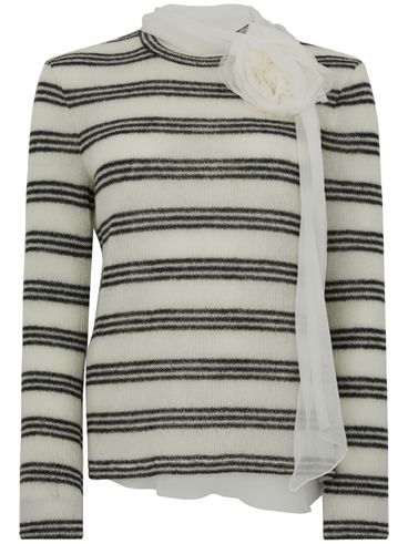 White striped shirt with black stripes and floral detail