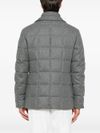 Quilted jacket in virgin wool padded with goose down.