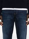 Jeans slim in cotone a vita media