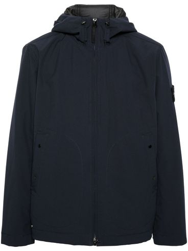 High-neck jacket with logo patch.