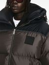 Down jacket in technical fabric with applied logo