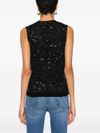 Top in maglia con paillettes