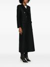 Long wool coat with shoulder pads.