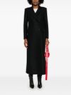 Long wool coat with shoulder pads.