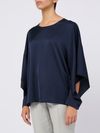 Blusa blu con maniche aperte