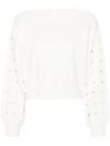 White sweater with rhinestones.