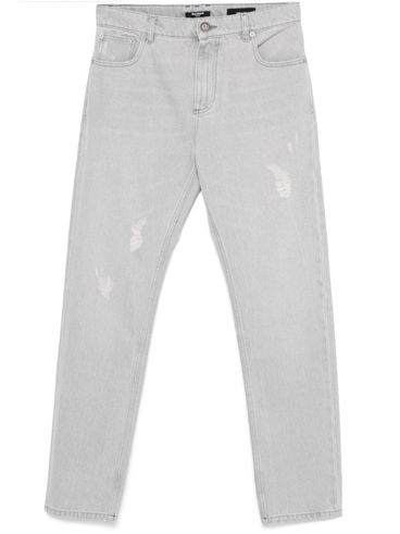 Straight-leg cotton jeans with distressed detail.