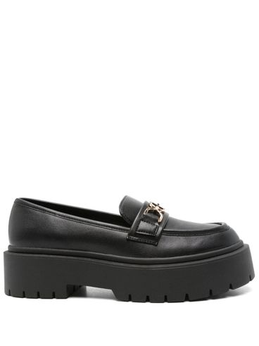 Black loafers with logo buckle