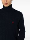 Blue knitted wool turtleneck sweater