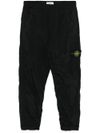 stone island - Pantaloni con logo bussola