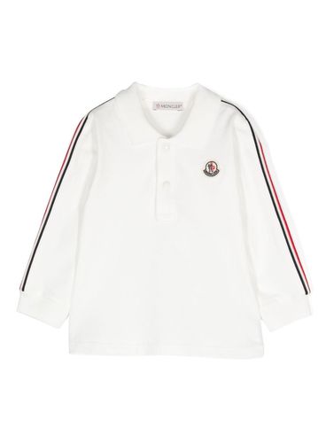 Polo in cotone con righe e logo