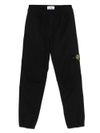 stone island - Pantaloni tuta in cotone nero con patch logo