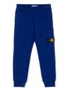 stone island - Pantaloni tuta in cotone blu con tasca e logo