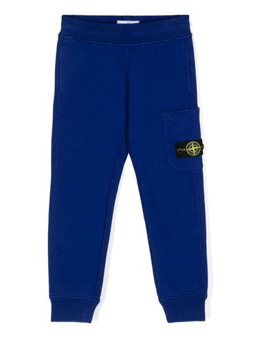 STONE ISLAND - Pantaloni tuta in cotone blu con tasca e logo