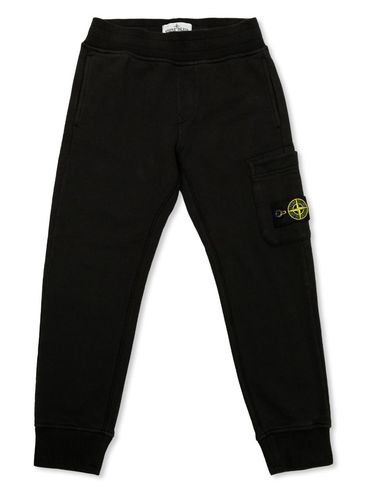 STONE ISLAND - Pantaloni tuta in cotone nero con tasca e logo