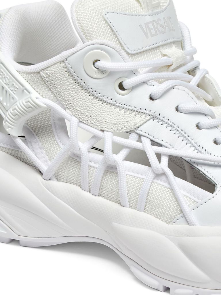 White sneakers with panelled design and cut-out