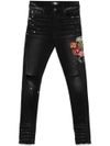 amiri - Skinny jeans with patches