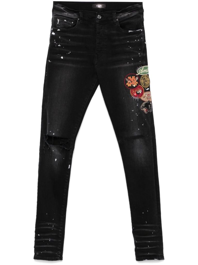 Shop Amiri Skinny Jeans With Patches In Black