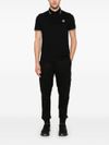 stone island - Polo in cotone nero a maniche corte con righe - 1