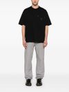 carhartt wip - T-shirt in cotone nero con tasca - 1