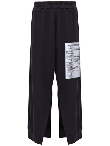 MM6 MAISON MARGIELA - Pantaloni sportivi neri con dettagli cut