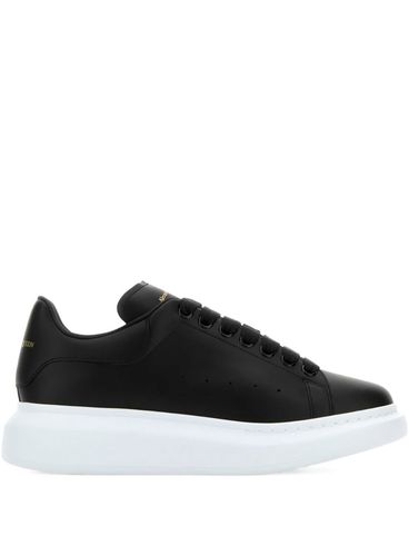 ALEXANDER McQUEEN - Oversized black leather sneakers with contrasting platform
